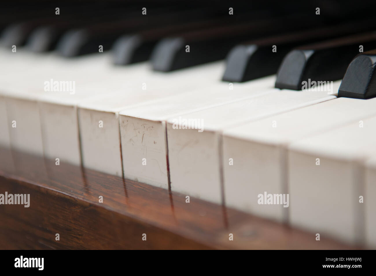 Vintage piano keys on an old wooden piano Stock Photo Alamy