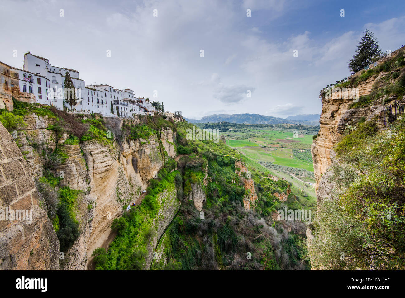 Panoramic view from Puente Nuevo New Bridge in Ronda, Spain with rural ...