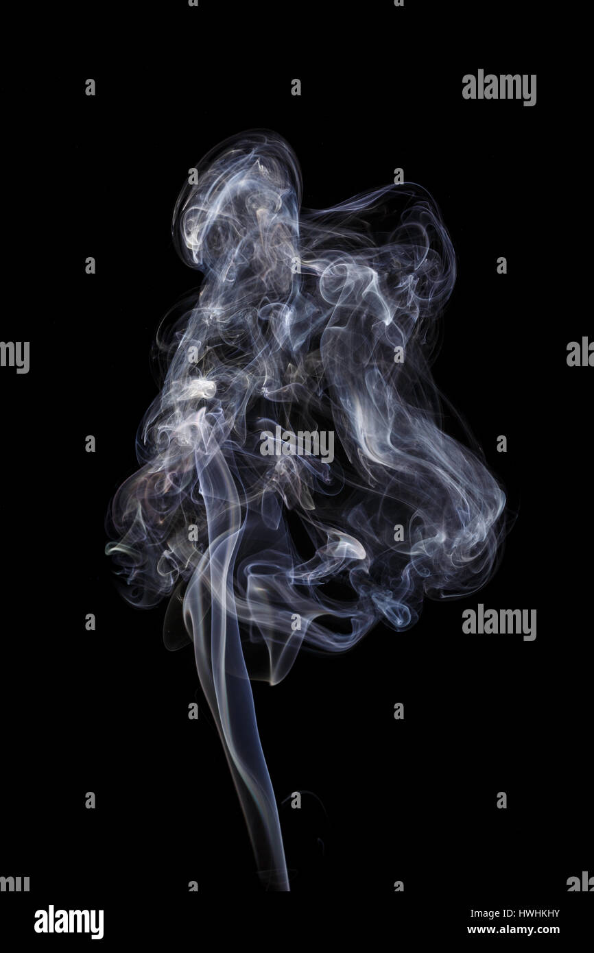 Abstract art. Color white blue smoke from the aromatic sticks on a