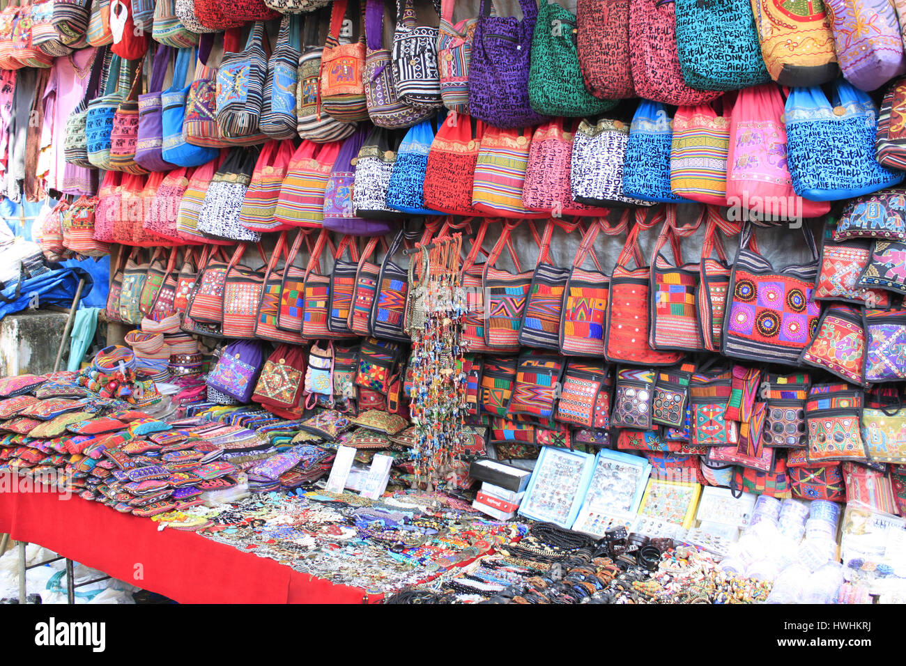 Colorful bags and trinkets on display in a shop. Goa, India Stock Photo