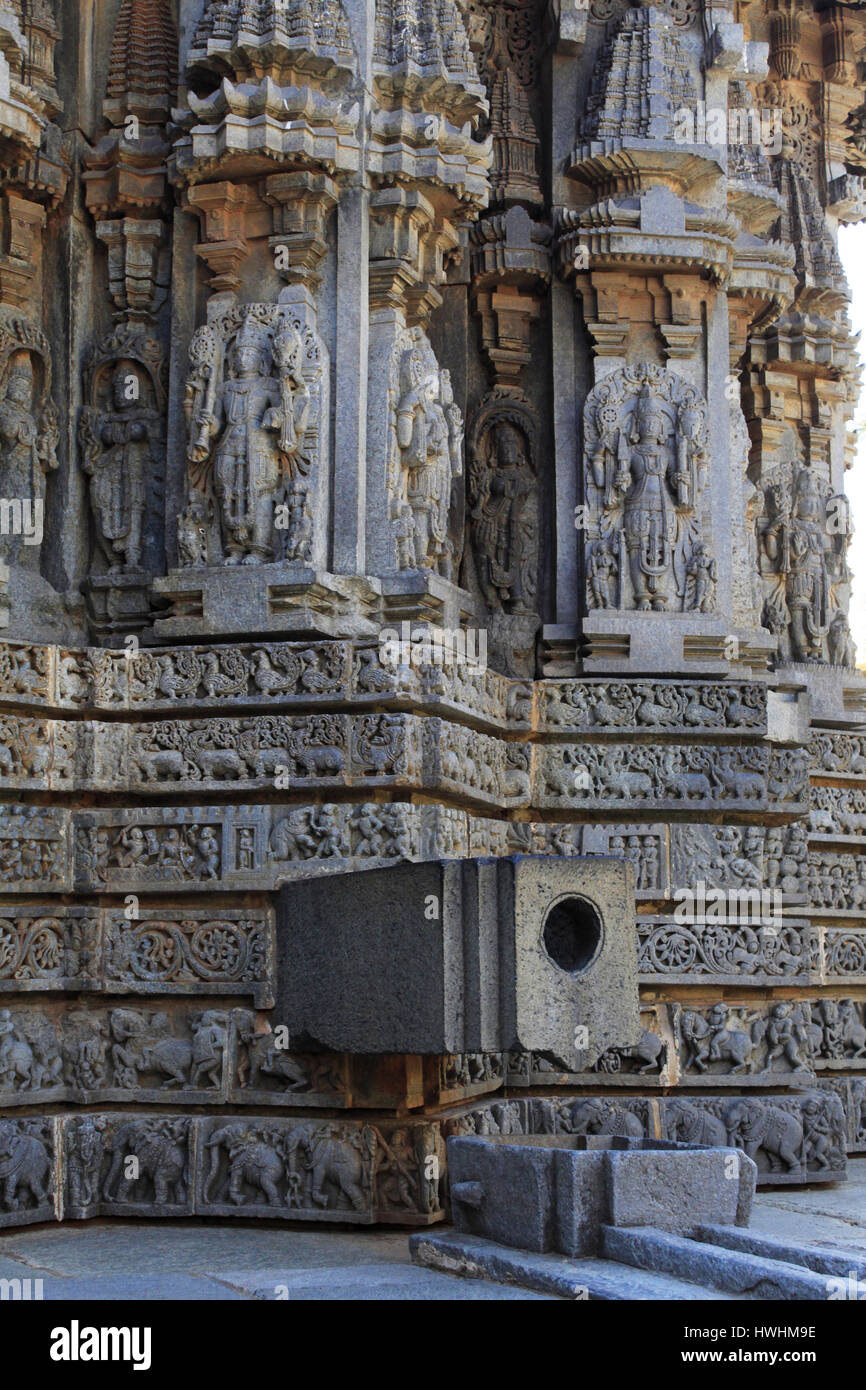 Shrine wall relief sculpture follows a stellate plan, this wall has a water outlet coming from main shrine, in the Chennakesava Temple, Hoysala Archit Stock Photo