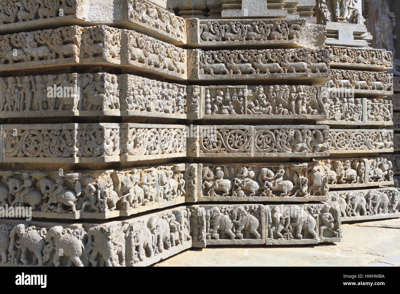 Shrine wall relief sculpture follows a stellate plan, depicting Swans, makara(imaginary beast), Hindu puranas, foliage, horsemen and elephants Stock Photo