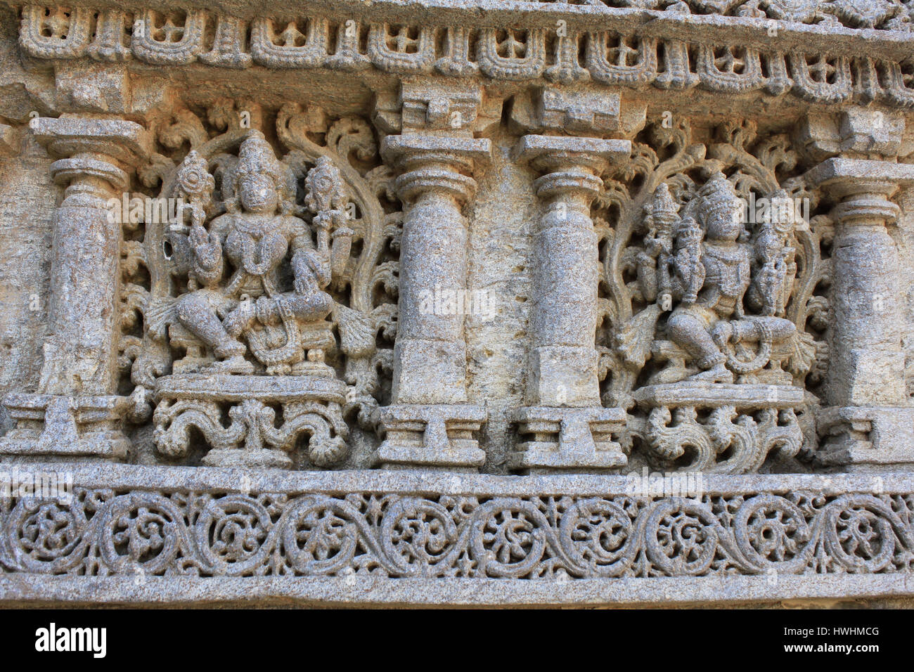 Close up of detailed stone carving of deities, goddess on the shrine wall at Chennakesava Temple, Hoysala Architecture, Somanthpur, Karnataka, India. Stock Photo