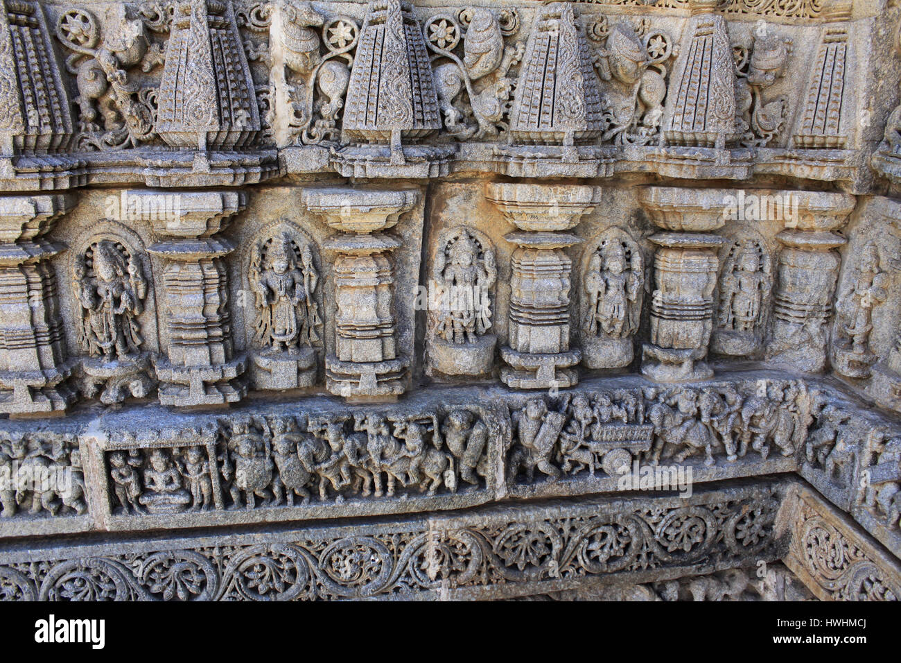 Close up of stone carvings, of deities, sculptures include of depictions of affluence of that age including members of the royal family riding richly  Stock Photo