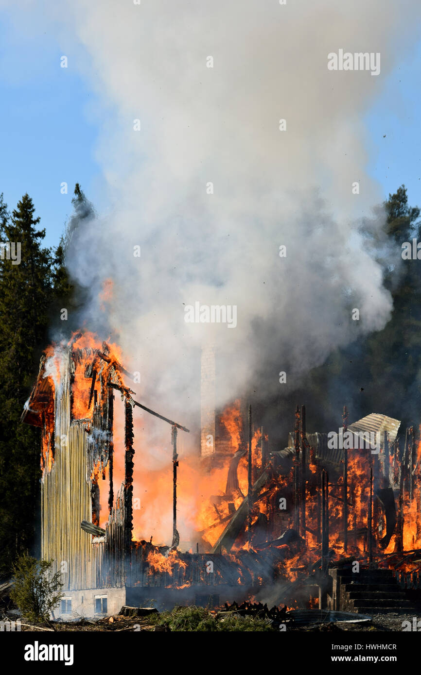 Burning house. Vertical image. Stock Photo