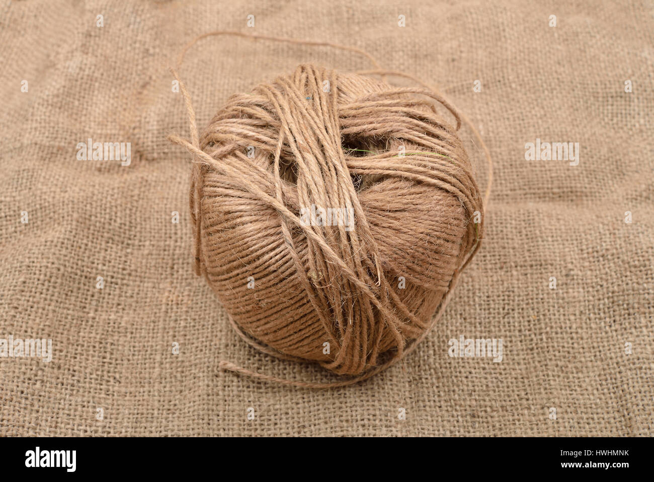 Close up of hank of twine, reel of rope, ball of hemp thread on