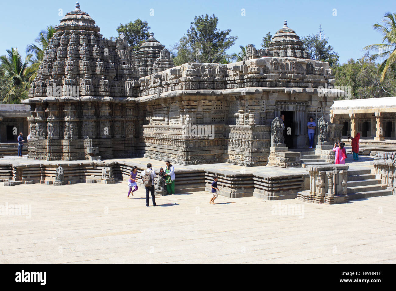 Side view mid shot, showcasing stellate design towers, ornamented, detailed stone  star-shaped plinth, at Chennakesava Temple, Hoysala Architecture, S Stock Photo