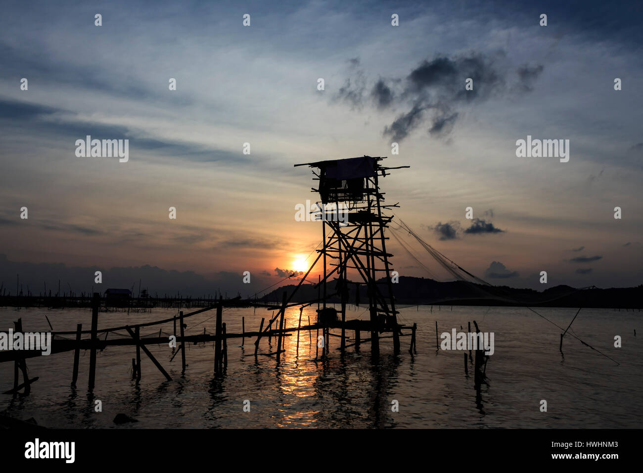 Fishing net and sunset Stock Photo - Alamy