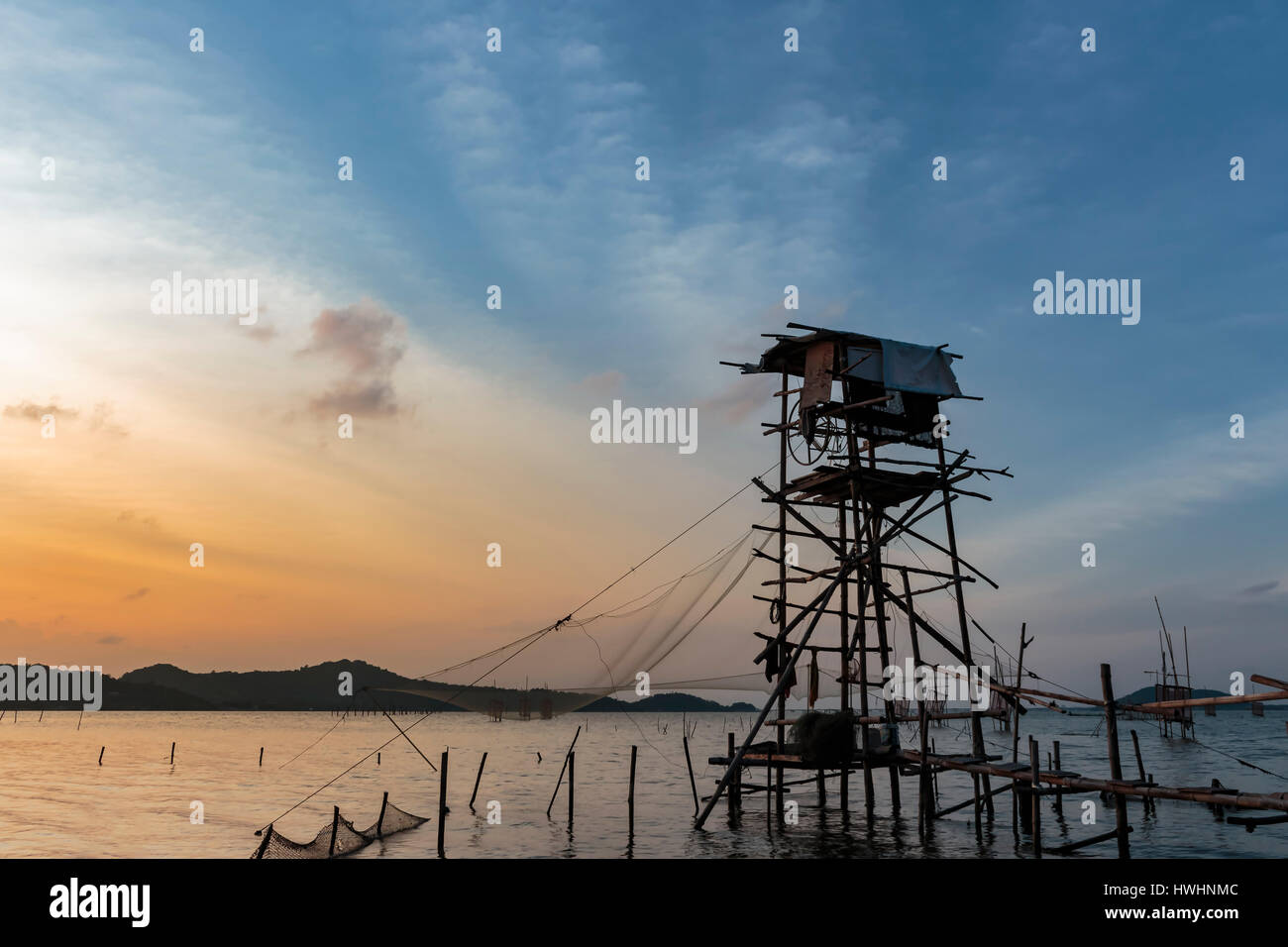 Fishing net and sunset Stock Photo - Alamy
