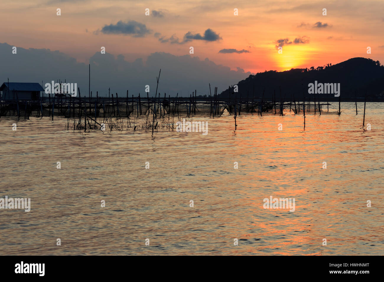 Fishing net and sunset Stock Photo - Alamy