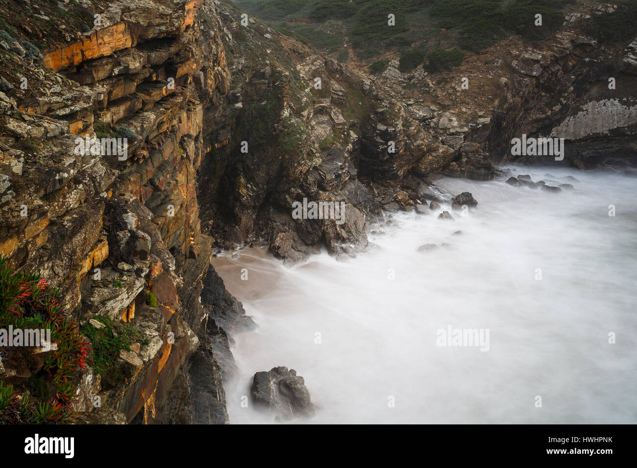 Sea cliffs, Odeceixe, Atlantic coast, Algarve, Portugal. Long exposure. Stock Photo