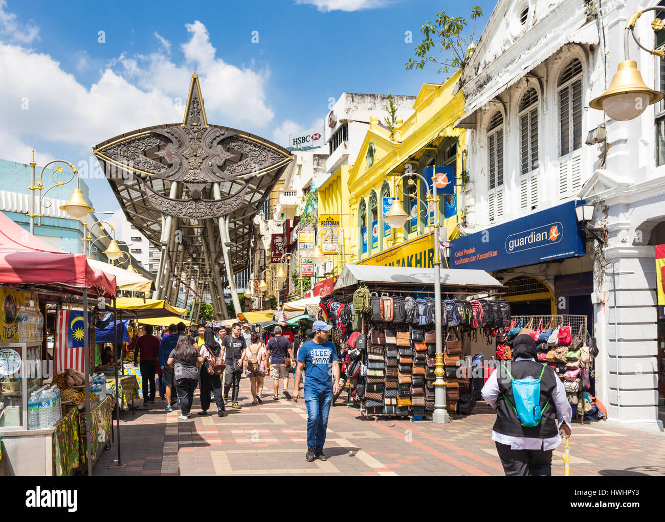 KUALA LUMPUR, MALAYSIA - JANUARY 14, 2017: People walk along the Kasturi walk and the Central Market in the heart of Kuala Lumpur Chinatown in Malaysi Stock Photo