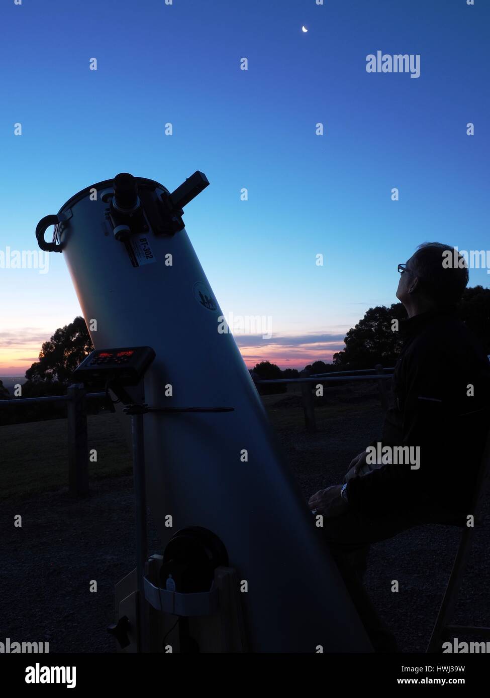 Astronomer and telescope Stock Photo