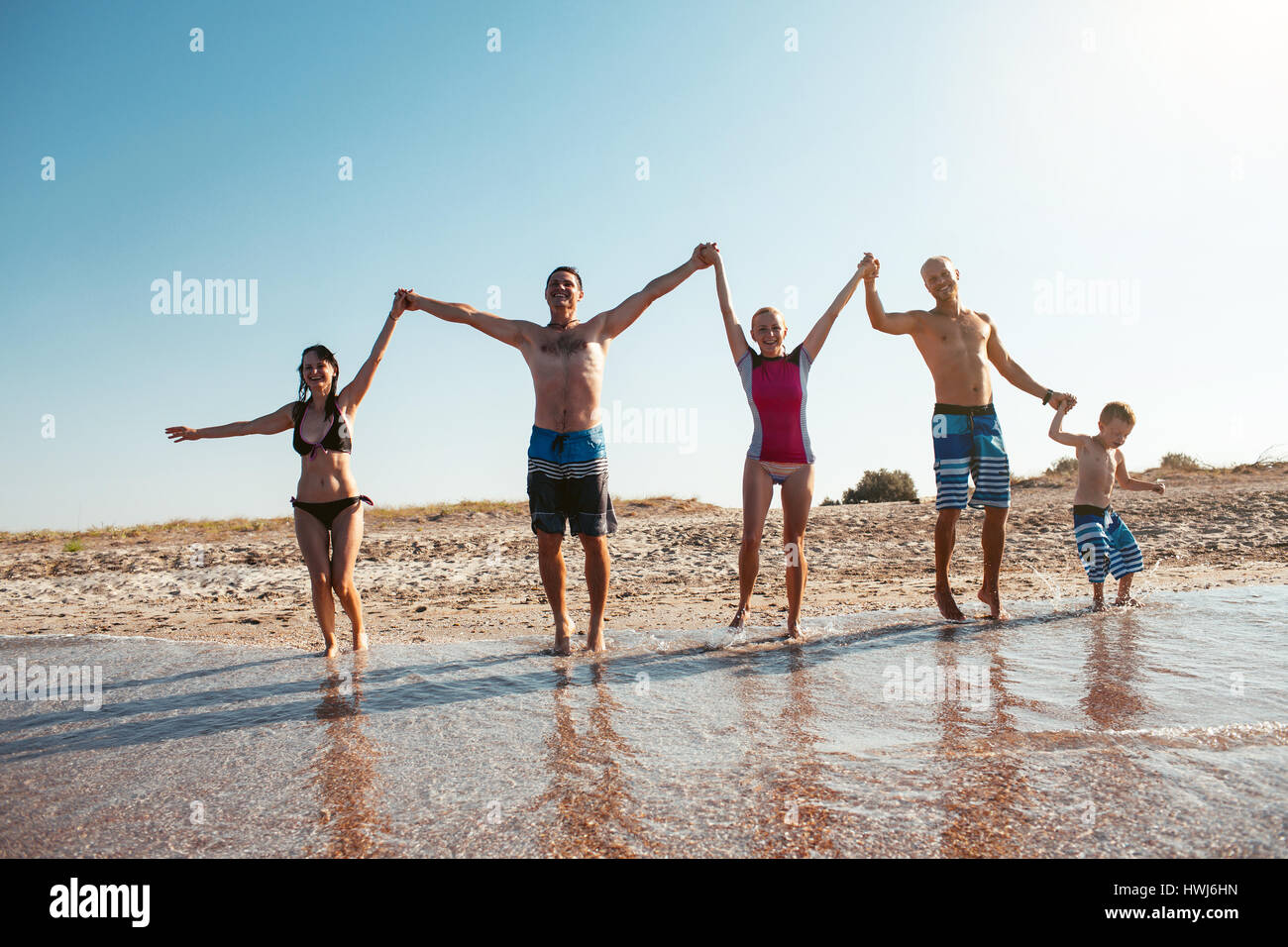 Groupe of people having fun at the beach. Friendship Freedom Beach