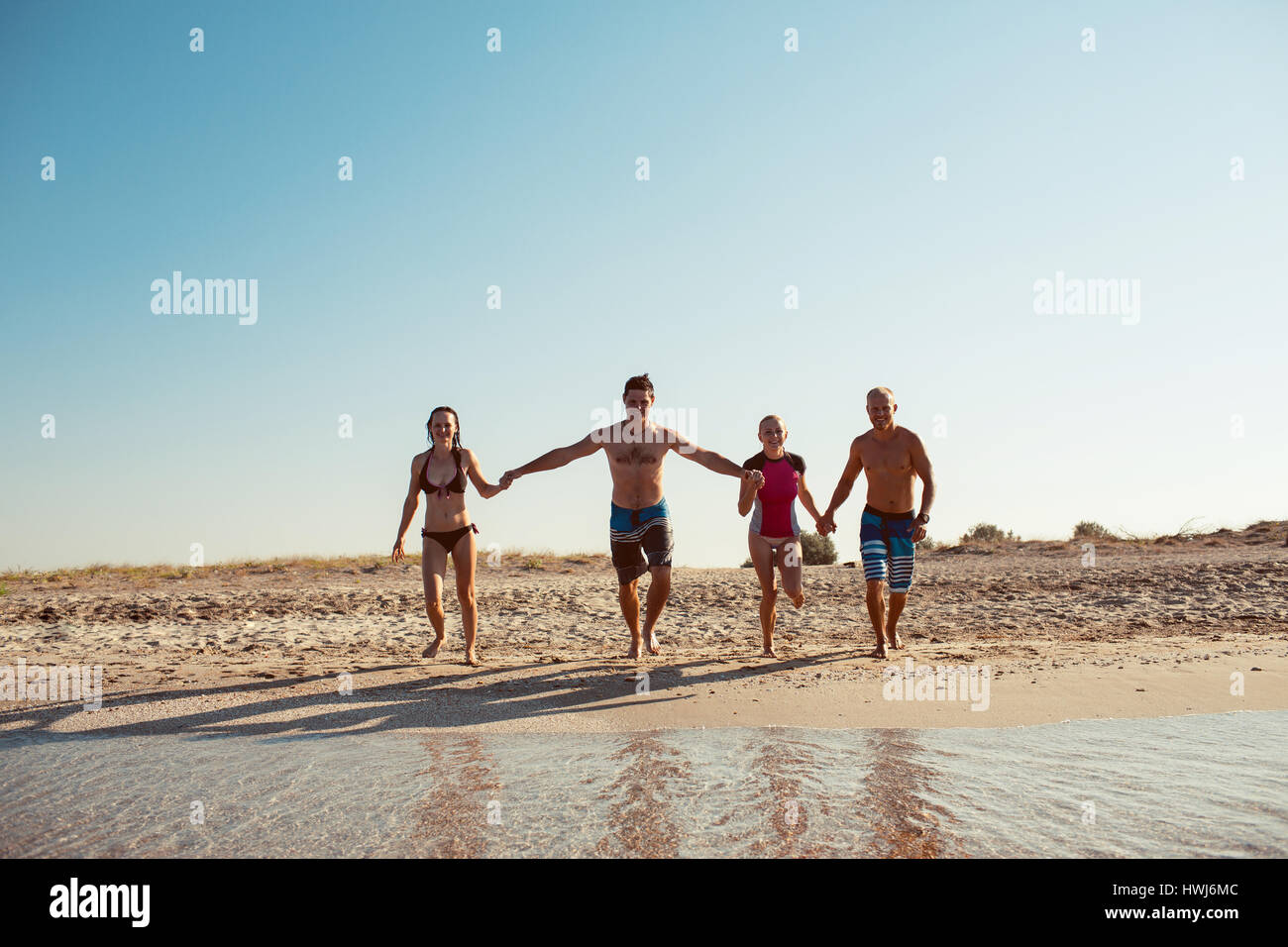 Groupe of people having fun at the beach. Friendship Freedom Beach