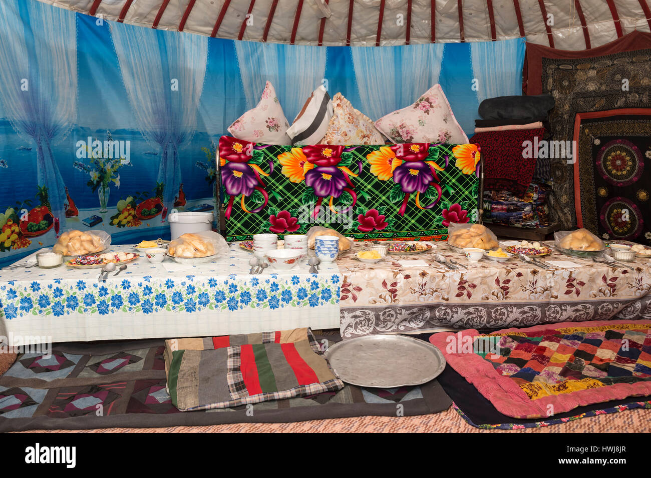 Table set for guests in a yurt, Ile-Alatau National Park, Assy Plateau, Almaty, Kazakhstan, Central Asia Stock Photo