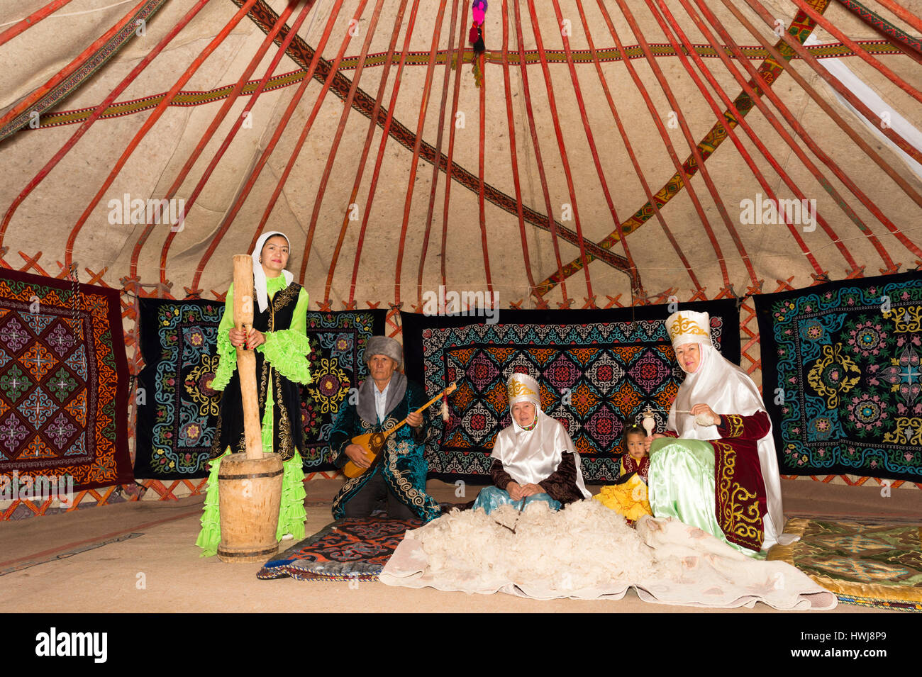 Kazakh women beating and spinning the wool, Kazakh ethnographical village Aul Gunny, Talgar city, Almaty, Kazakhstan, Central Asia, Asia, For editorial Use only Stock Photo