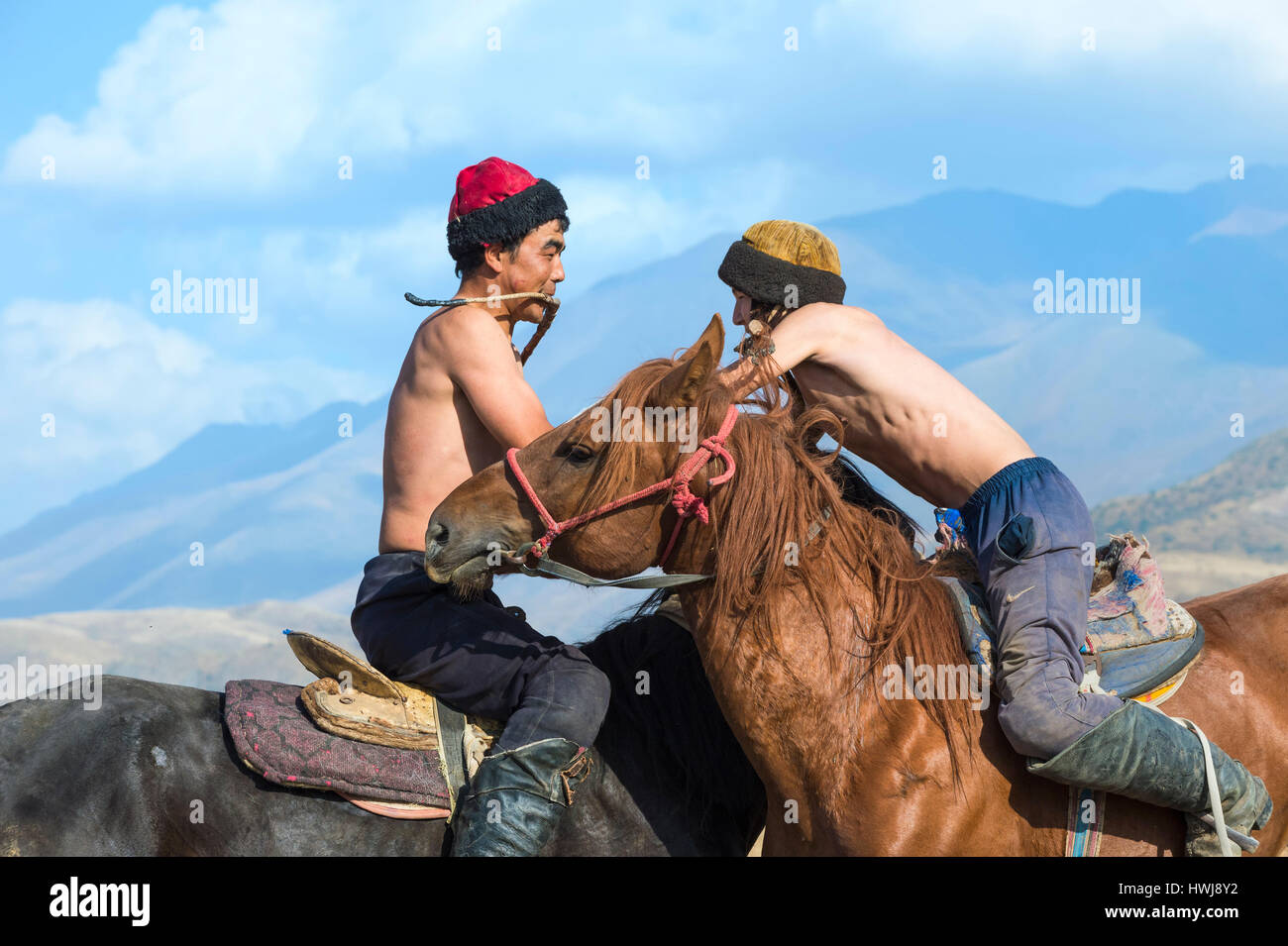 Atpen Audaraspak, Traditional Kazakh horseback arm wrestling game, Gabagly national park, Shymkent, South Region, Kazakhstan, Central Asia, For editorial use only Stock Photo