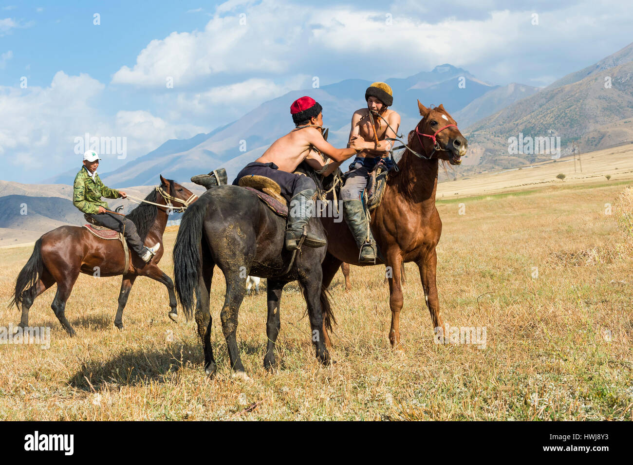 Atpen Audaraspak, Traditional Kazakh horseback arm wrestling game, Gabagly national park, Shymkent, South Region, Kazakhstan, Central Asia, For editorial use only Stock Photo