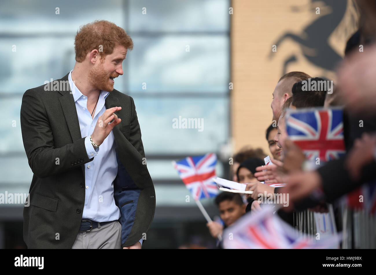 Prince Harry leaves after meeting representatives of the Yes You Can personal development project, which works to help under-performing Year 8 pupils to reach their full potential, at Hamilton Community College in Leicester. Stock Photo