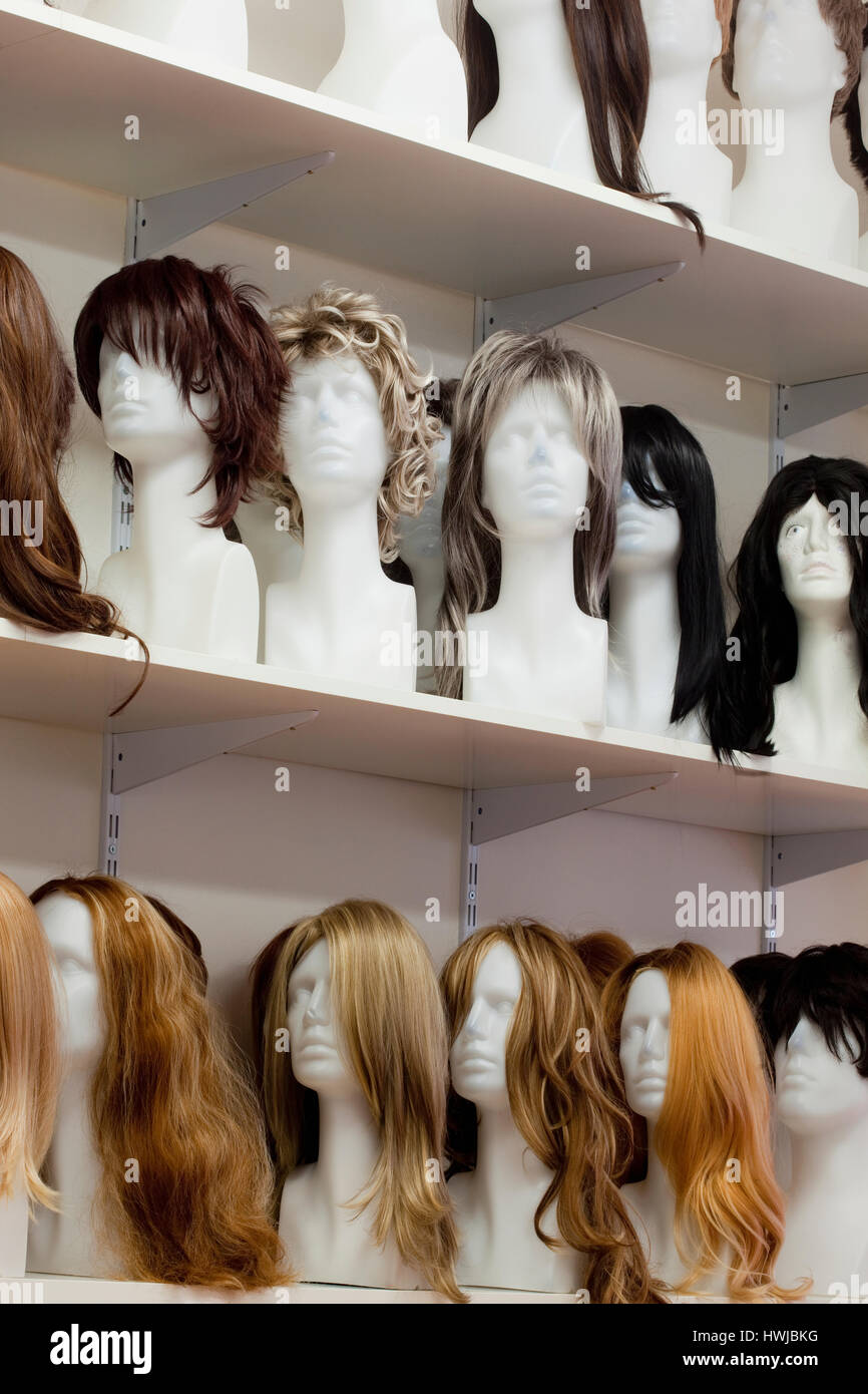 Row of Mannequin Heads with Wigs on the Shelf Stock Photo - Alamy