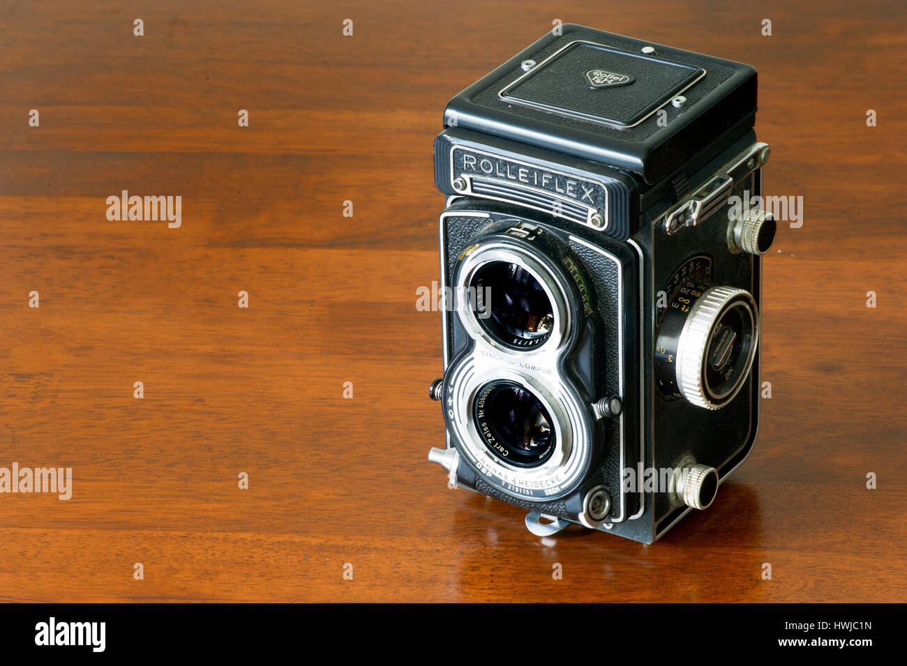 Vintage collectible bioptical Rolleiflex camera still life on wooden table Stock Photo