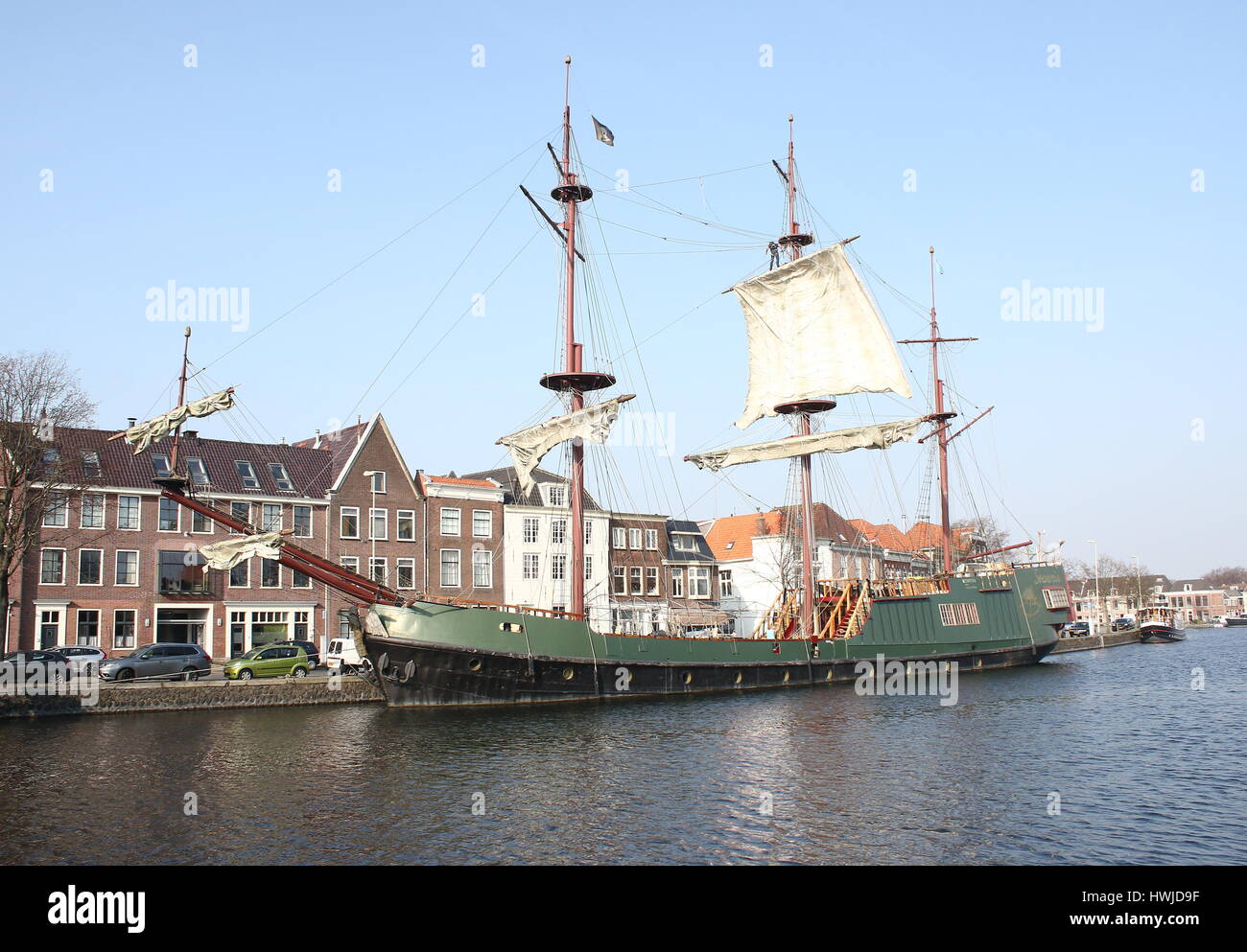 Historic replica sailing ship Soeverein (2005, loosely based on an East Indiaman VOC ship) moored along Spaarne river in central Haarlem, Netherlands Stock Photo