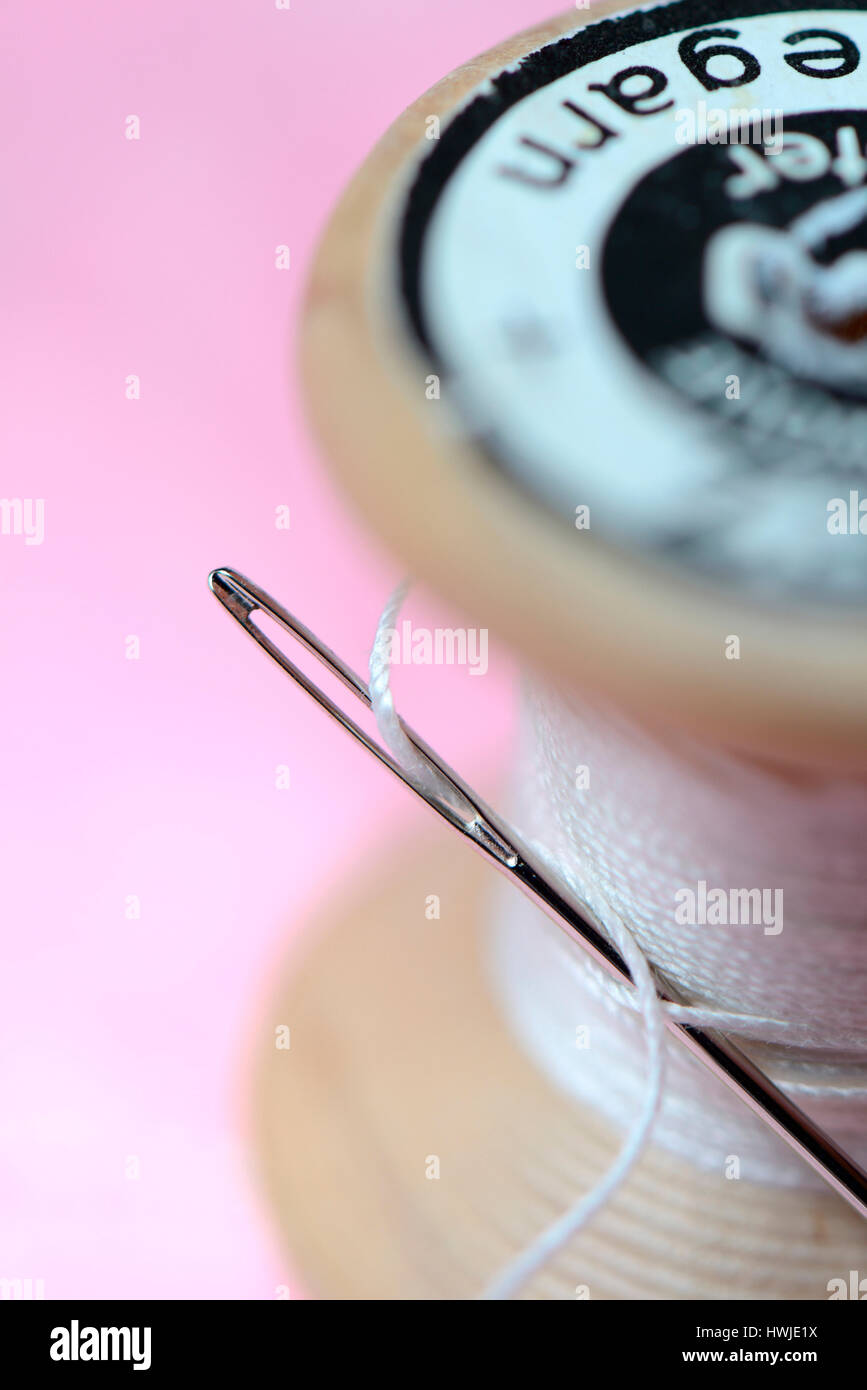 sewing needle and cotton reel Stock Photo Alamy