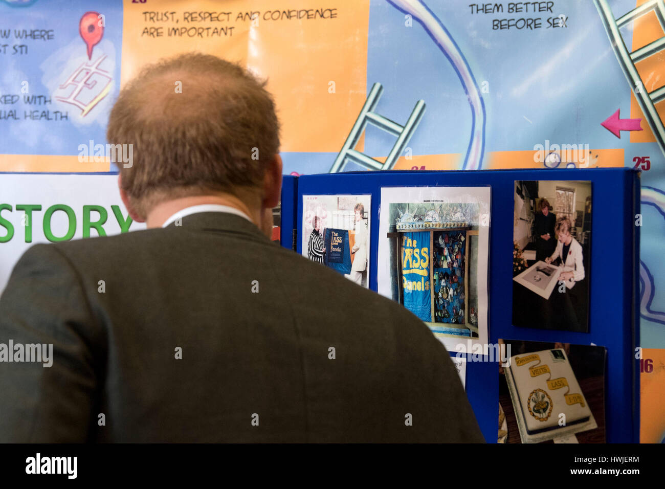 Prince Harry looks at photographs of his mother, Diana, Princess of