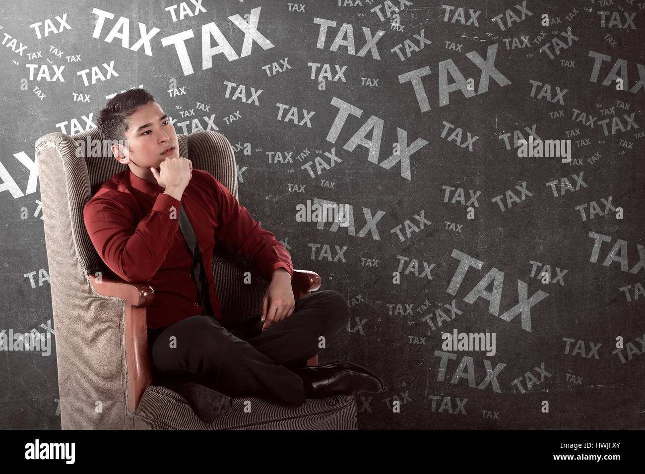 Asian business person thinking hard about tax. Taxation concept Stock Photo
