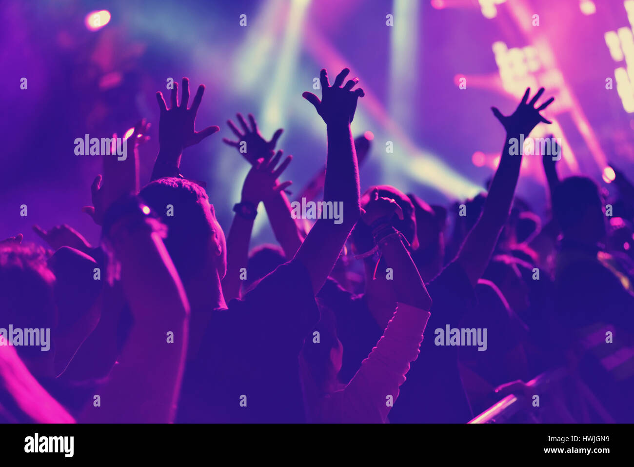 Rear View Of Crowd With Arms Outstretched At Concert Stock Photo - Alamy