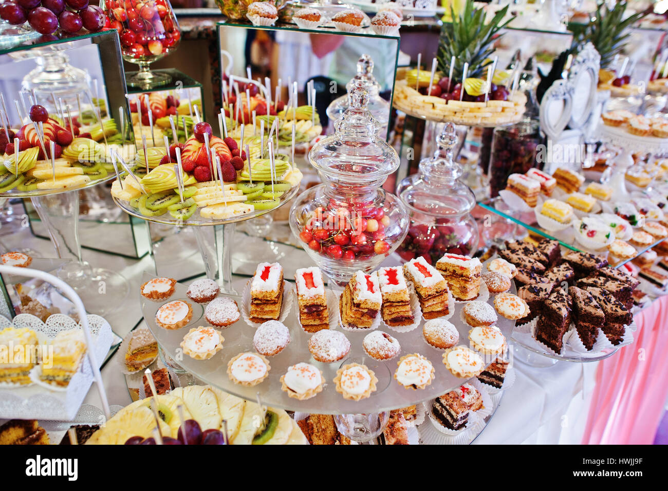 Wedding Reception Table With Different Fruits Cakes And Sweets
