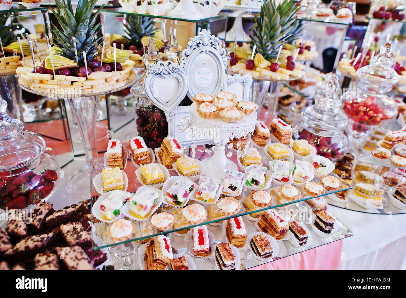 Wedding Reception Table With Different Fruits Cakes And Sweets