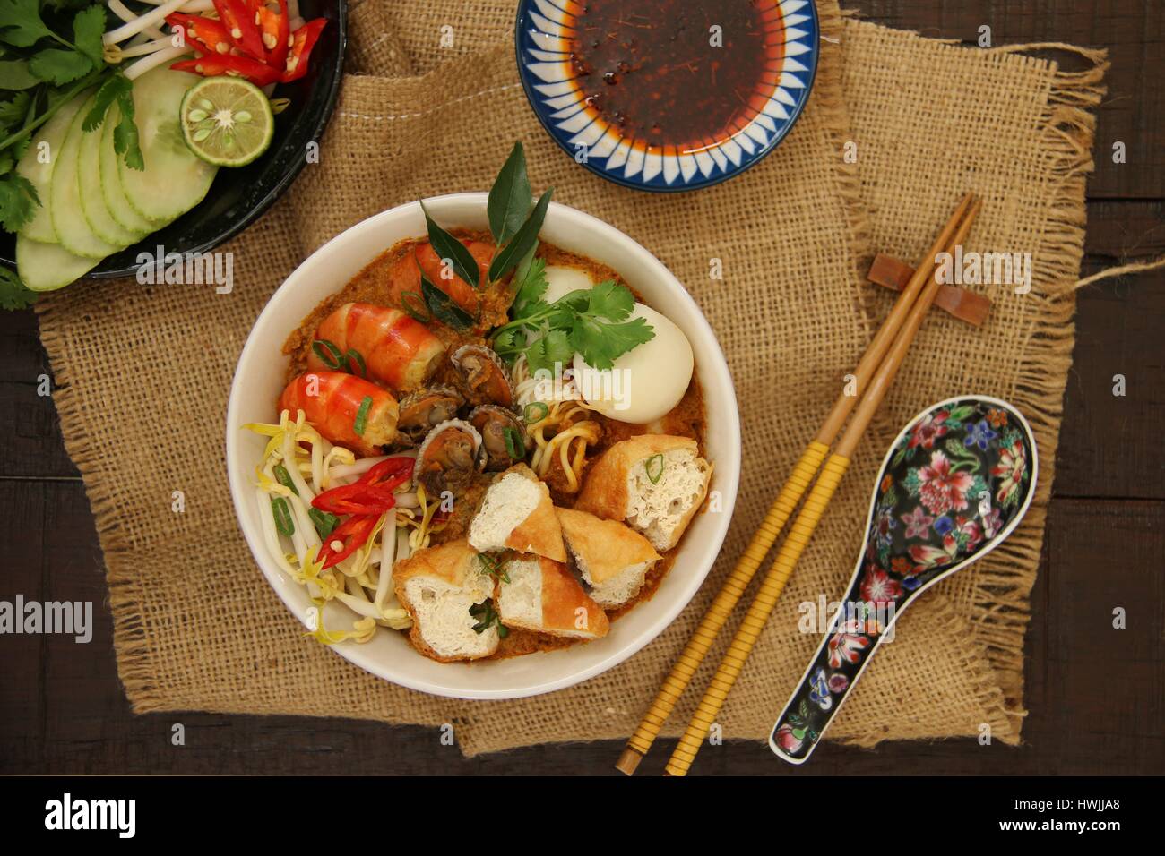 Curry Laksa. Peranakan curry noodle soup with seafood, bean curds, and
