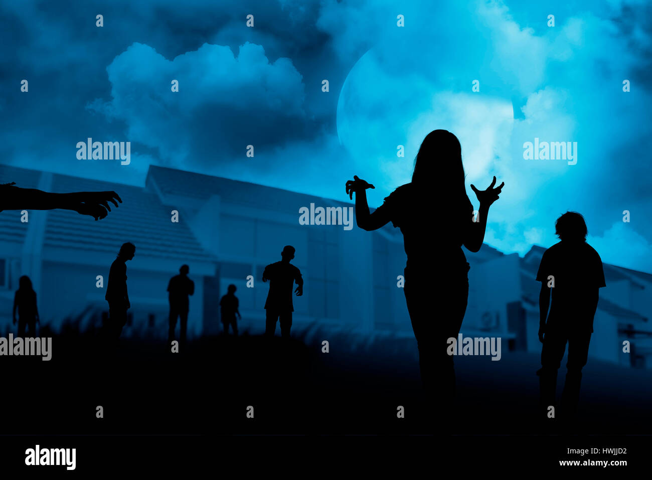 Silhouette group of zombie walking under full moon. Halloween concept Stock Photo