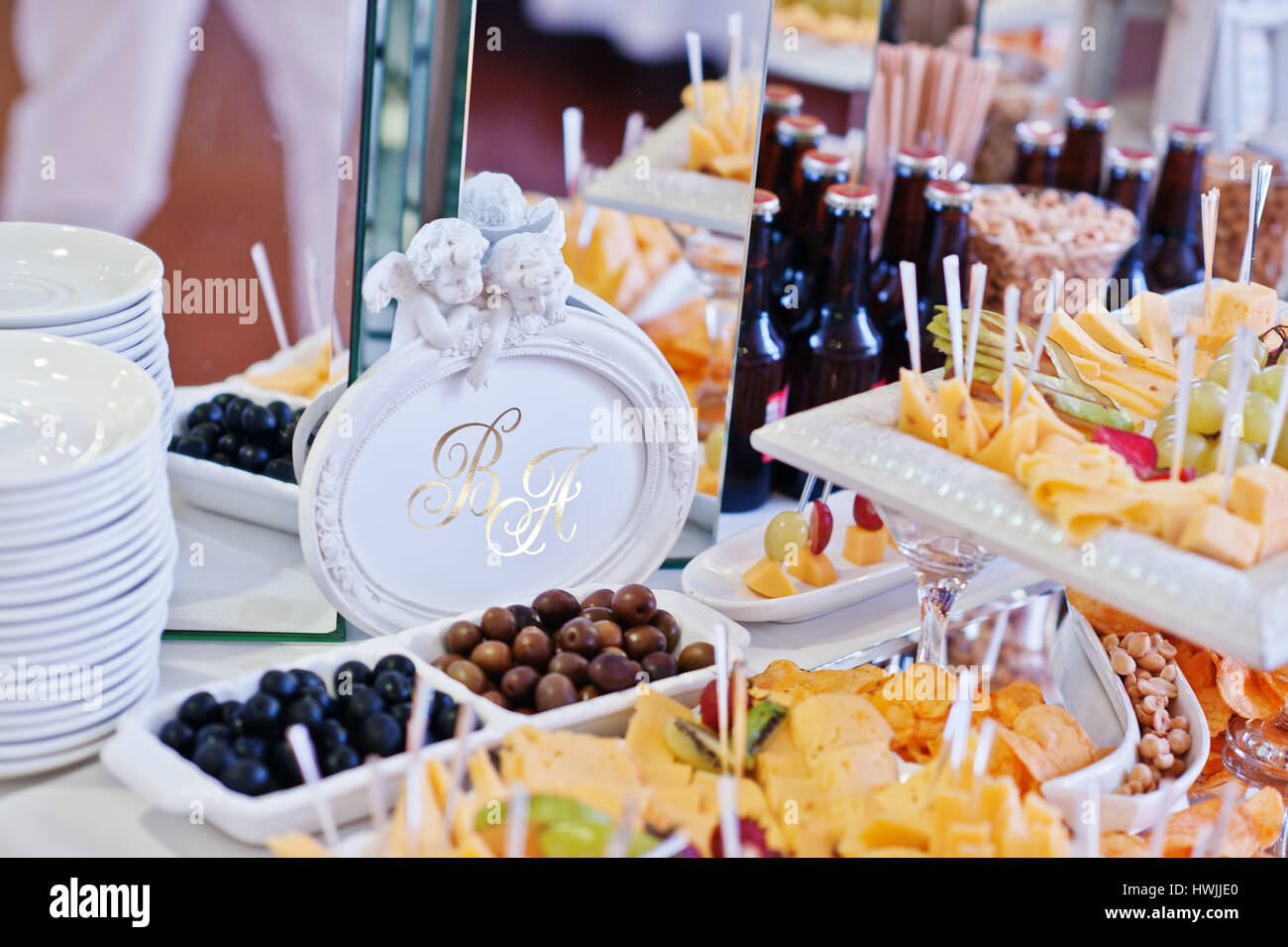 Wedding Reception Table With Different Cheese And Snacks For Beer