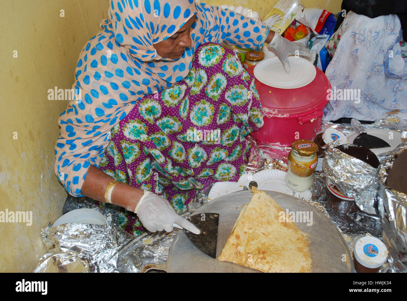 local Women preparing tradtional food at the Global Village, Dubai, United Arab Emirates Stock Photo
