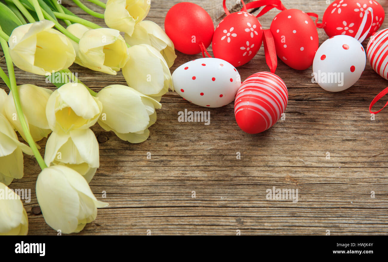 Easter eggs and tulips on wooden background with copy space Stock Photo ...