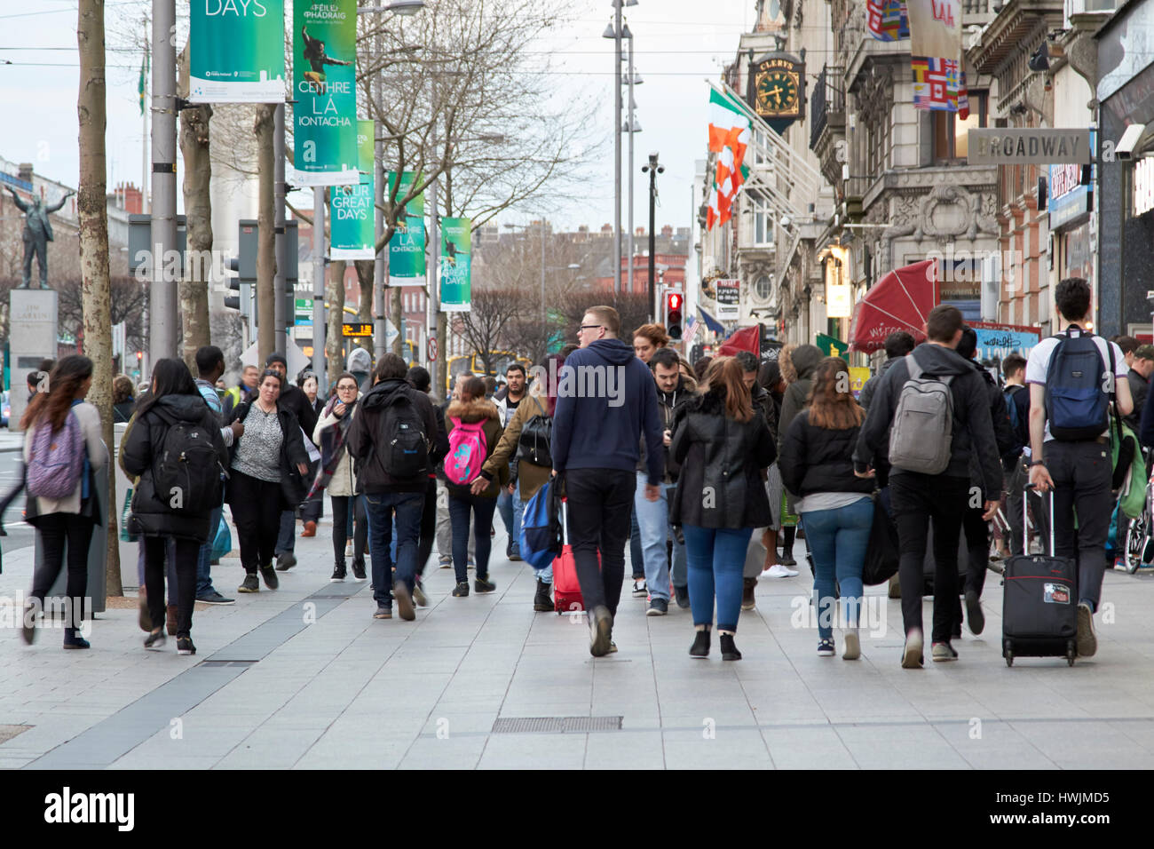 people walking along busy oconnell street footpath Dublin Republic of Ireland Stock Photo