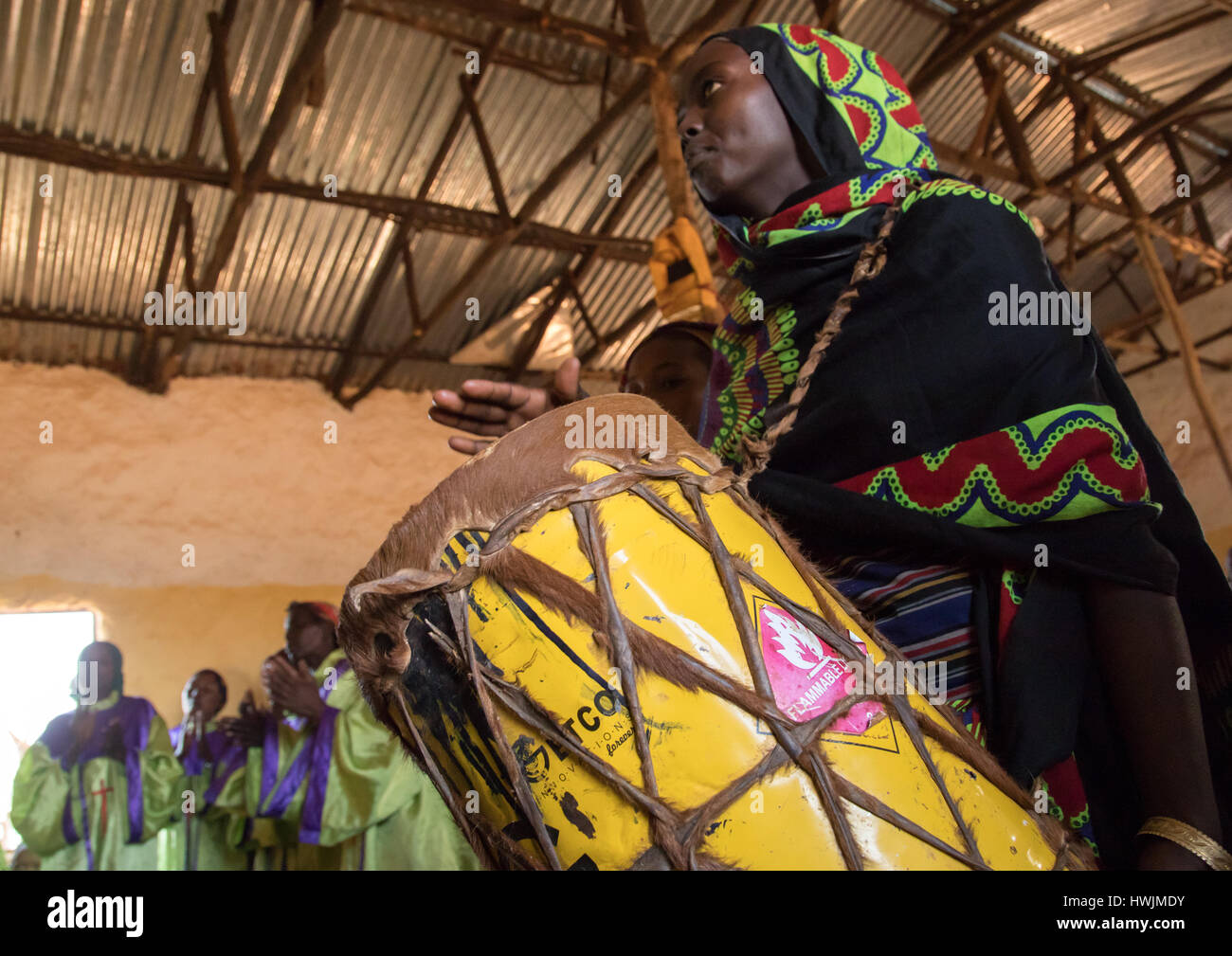 Borana woman playing drum during sunday church service, Oromia, Yabelo, Ethiopia Stock Photo Alamy