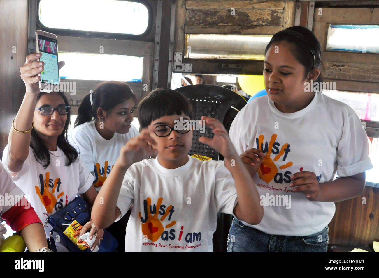 Kolkata, India. 21st Mar, 2017. Children with Down Syndrome rides a Tram during World Down Syndrome Day observation in Kolkata on March 21, 2017. The World Down Syndrome Day observes annually to raise awareness and create a global voice for their rights, inclusion and wellbeing with Down Syndrome. Credit: Saikat Paul/Pacific Press/Alamy Live News Stock Photo