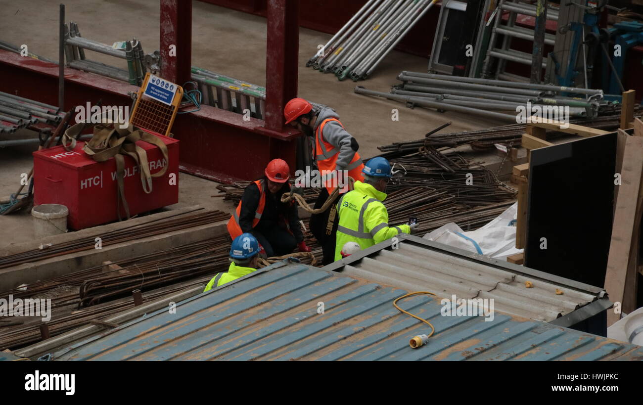 workers on a construction site building a new office block in london Stock Photo