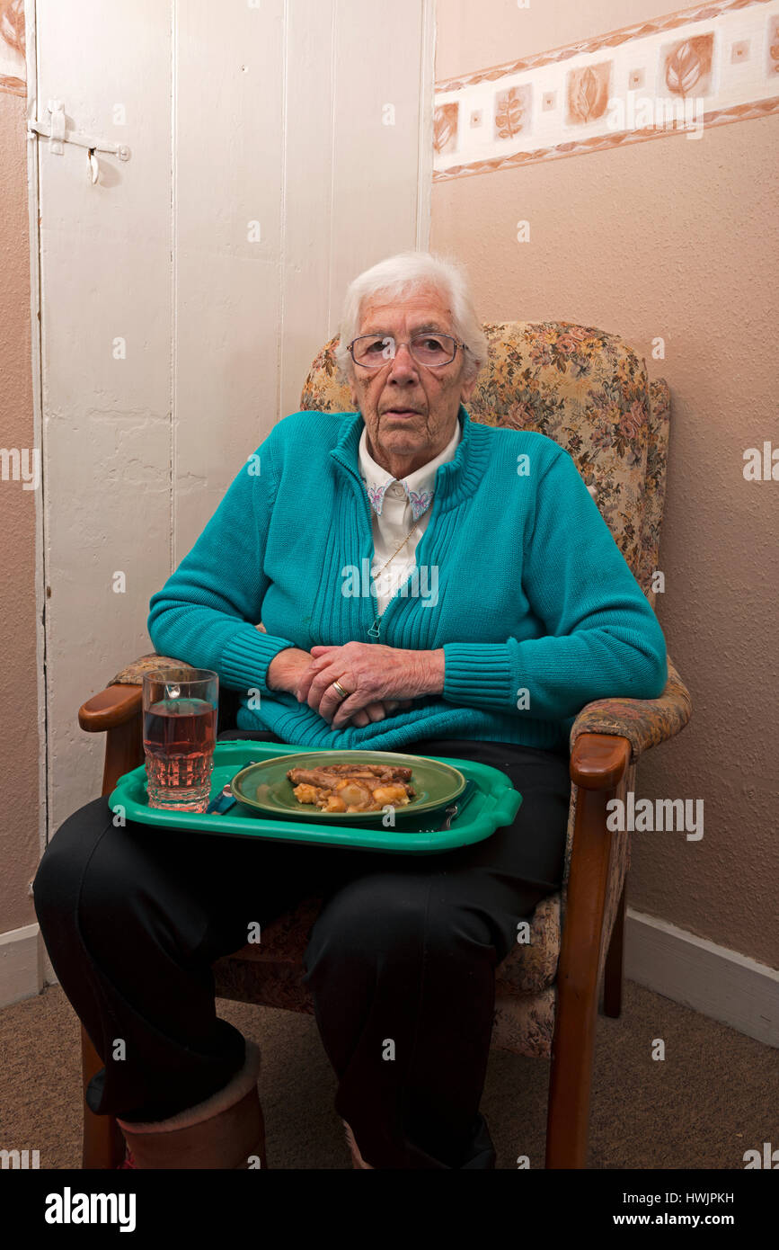 Elderly woman living alone eating lunch Stock Photo