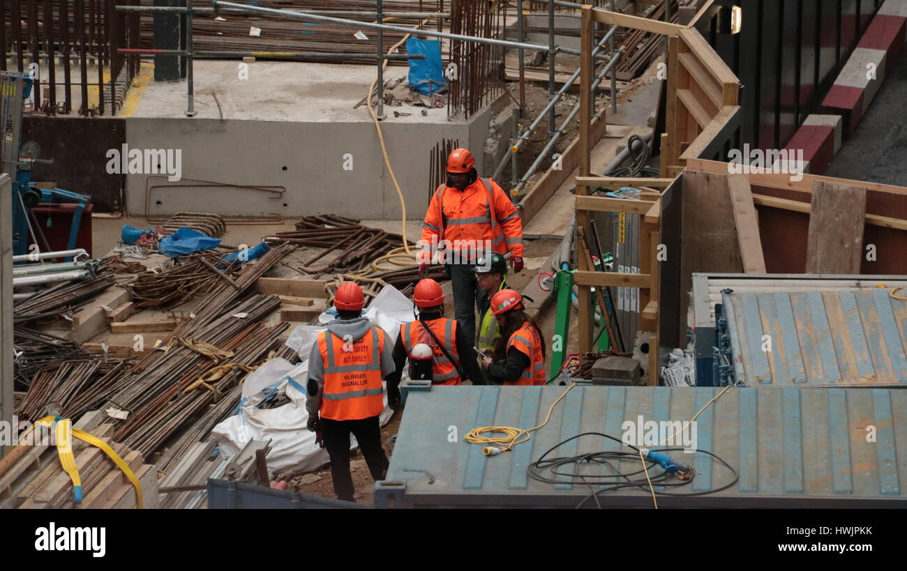 workers on a construction site building a new office block in london Stock Photo