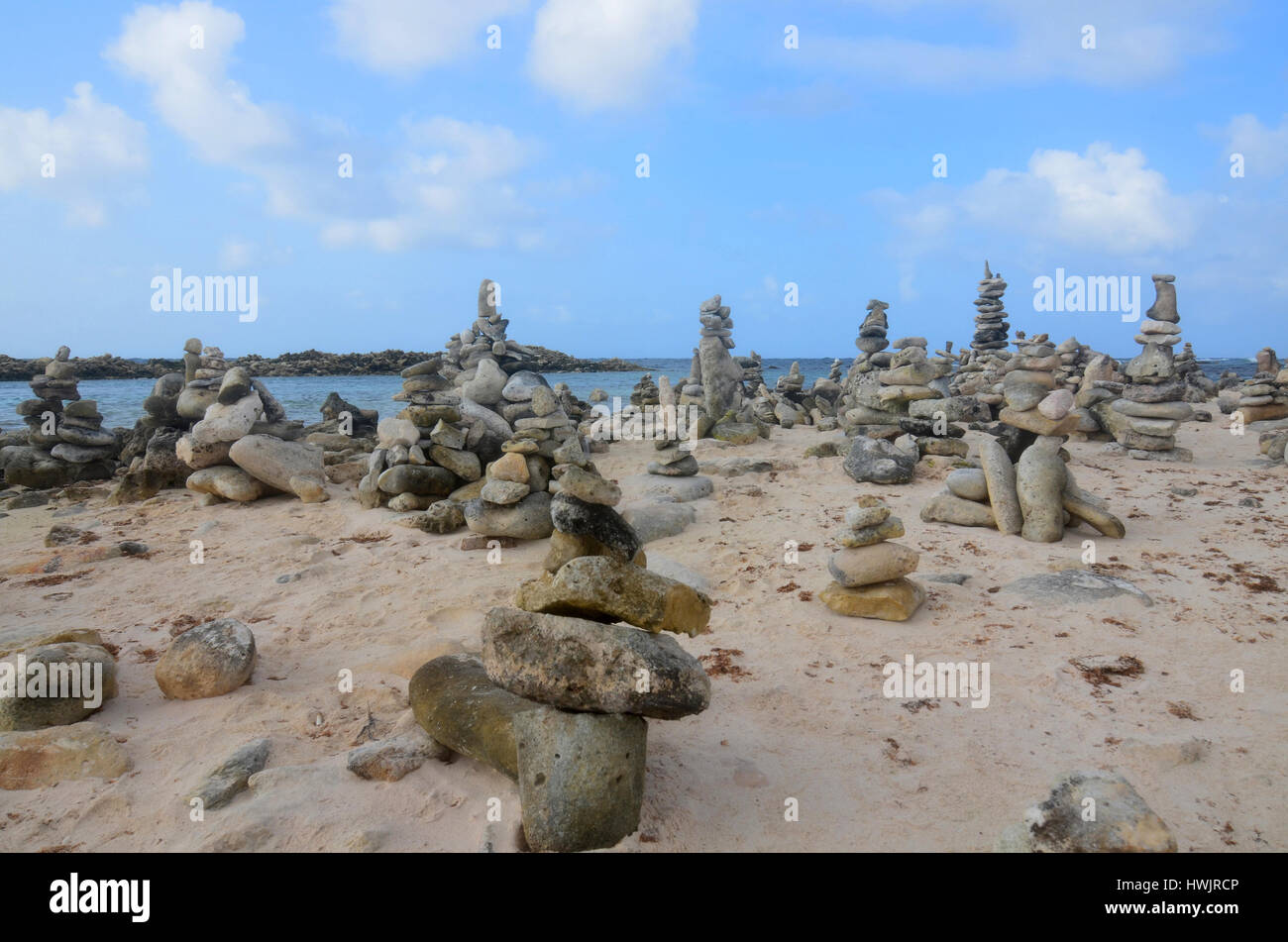 Stacked rock cairns beside the tropical waters of Aruba Stock Photo - Alamy