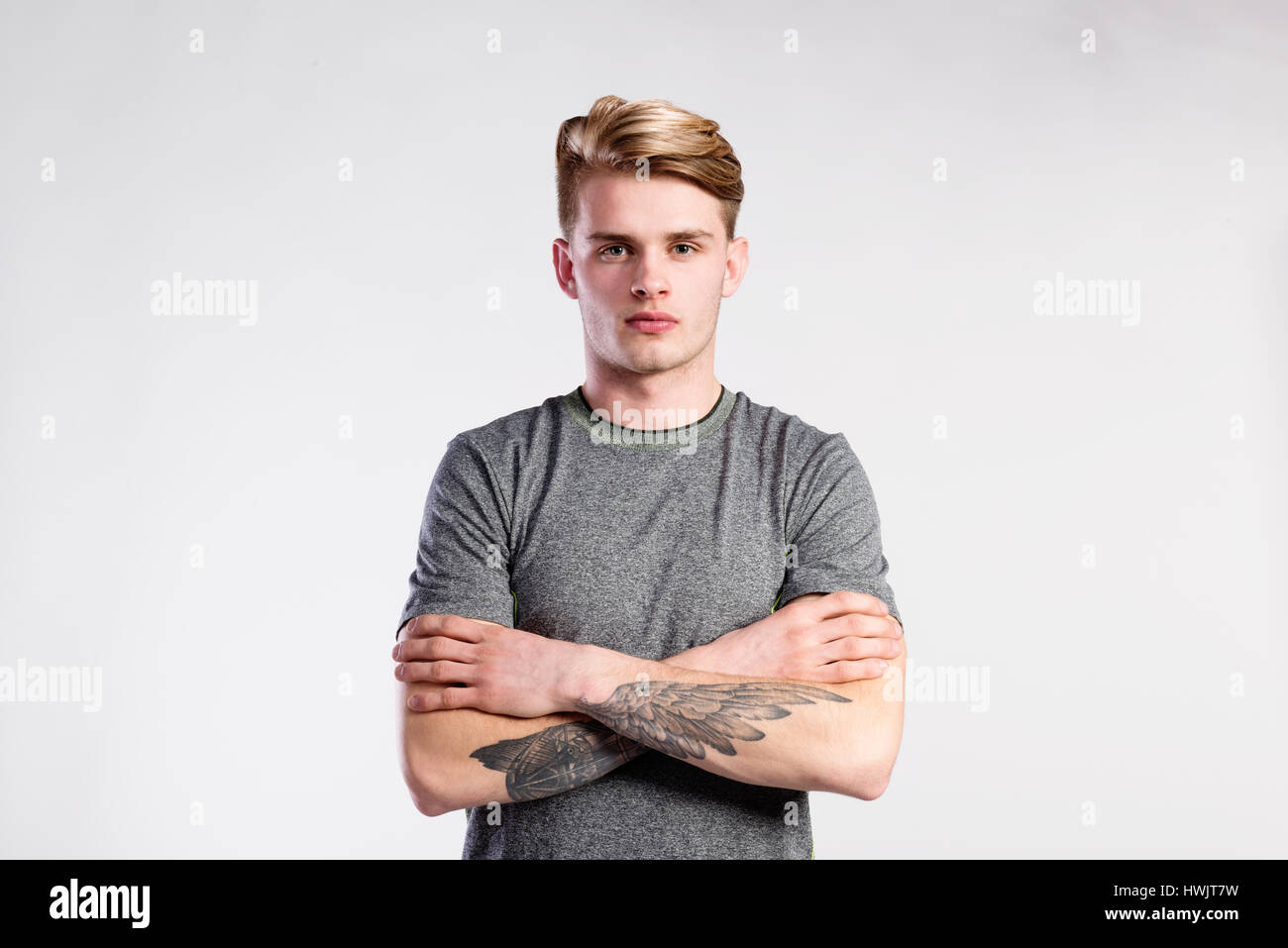 Tattoo standing arms crossed hi-res stock photography and images - Alamy