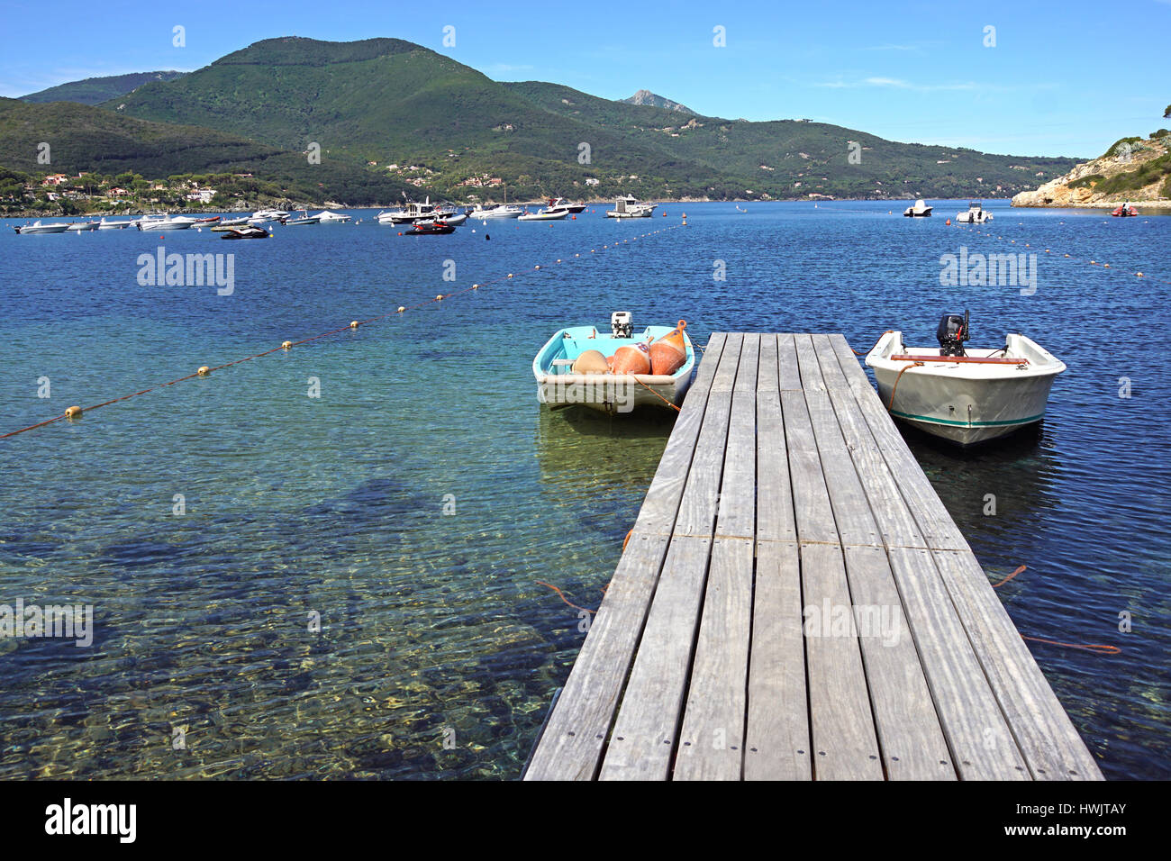 Pier with moored boats Stock Photo - Alamy