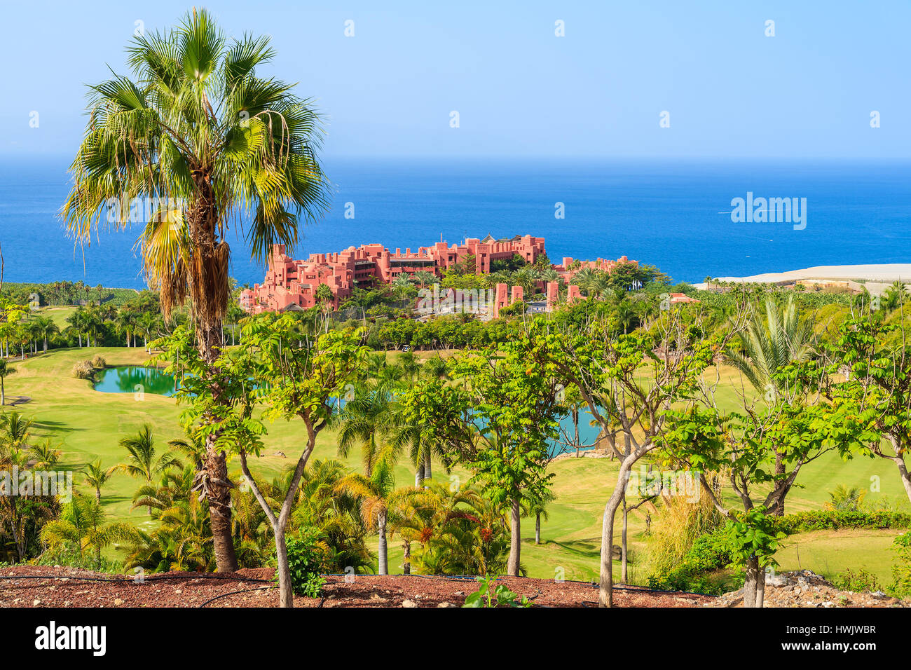 Golf course in tropical landscape of Tenerife island near San Juan town, Spain Stock Photo