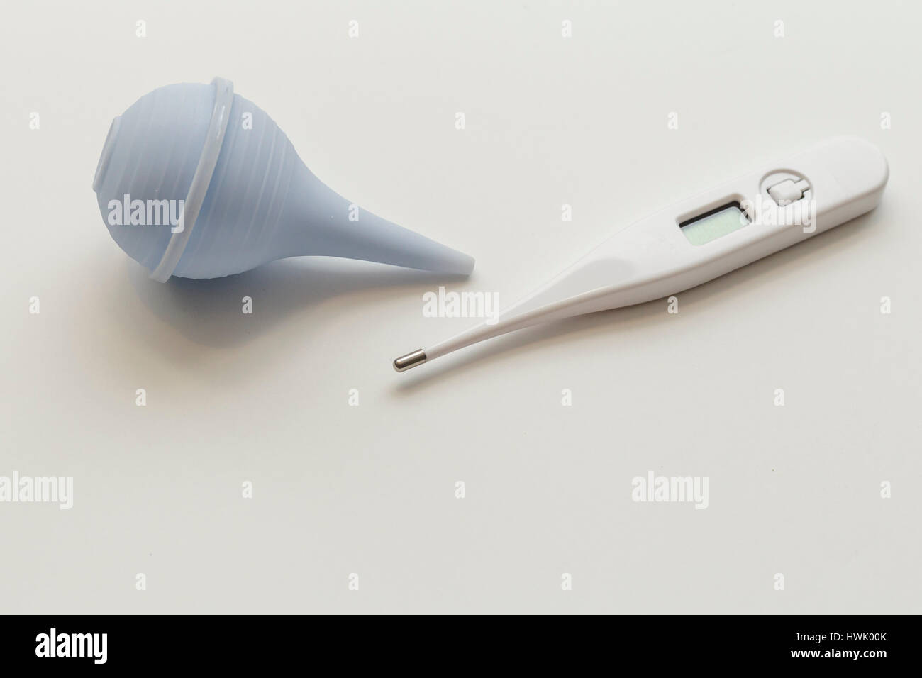 bulb syringe  with thermometer on white background Stock Photo