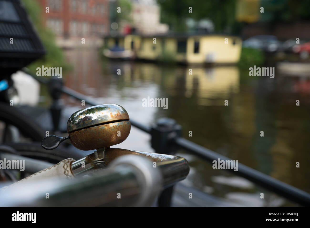 Rusty bicycle bell along a canal, Amsterdam Stock Photo